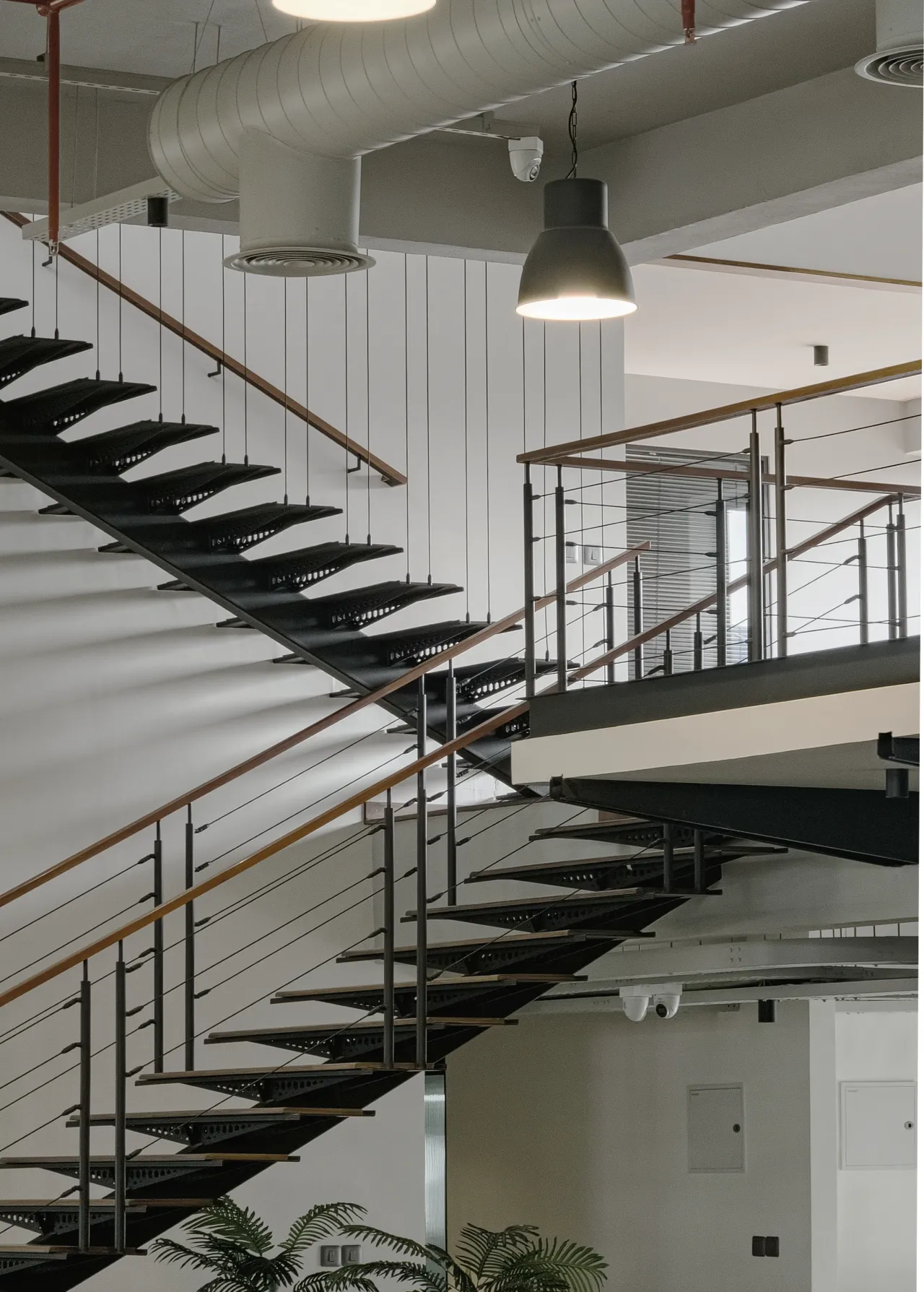 The stair connecting the office levels