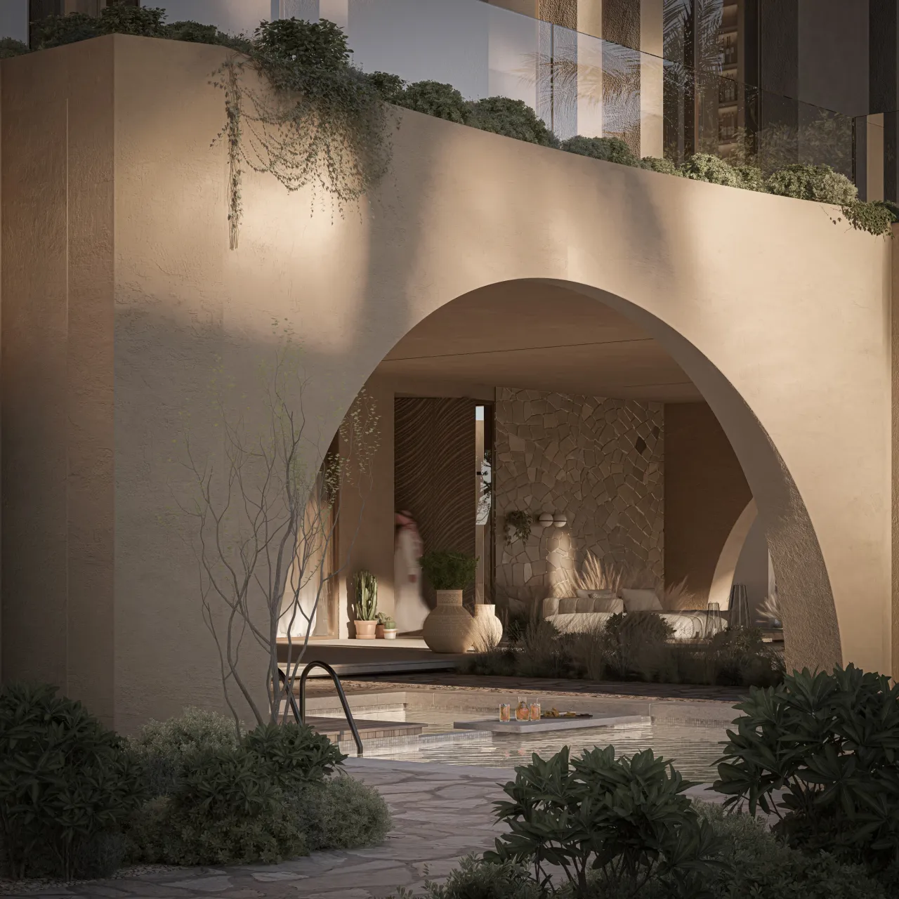 A deep arch framing a shaded seating area at Al Omigan Resthouse