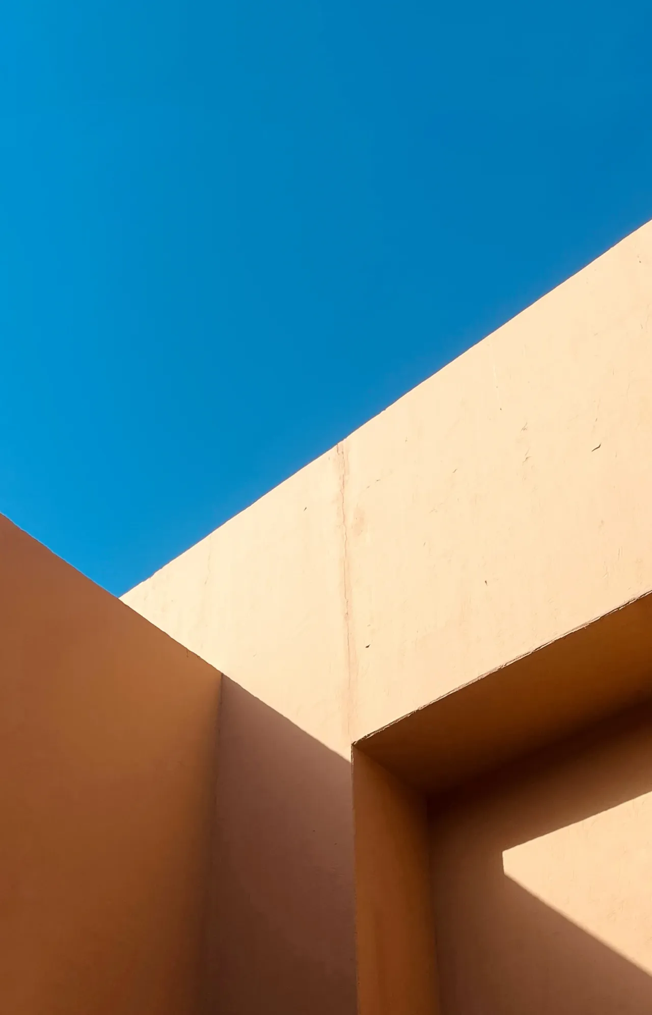 Sunlit walls framing a blue sky
