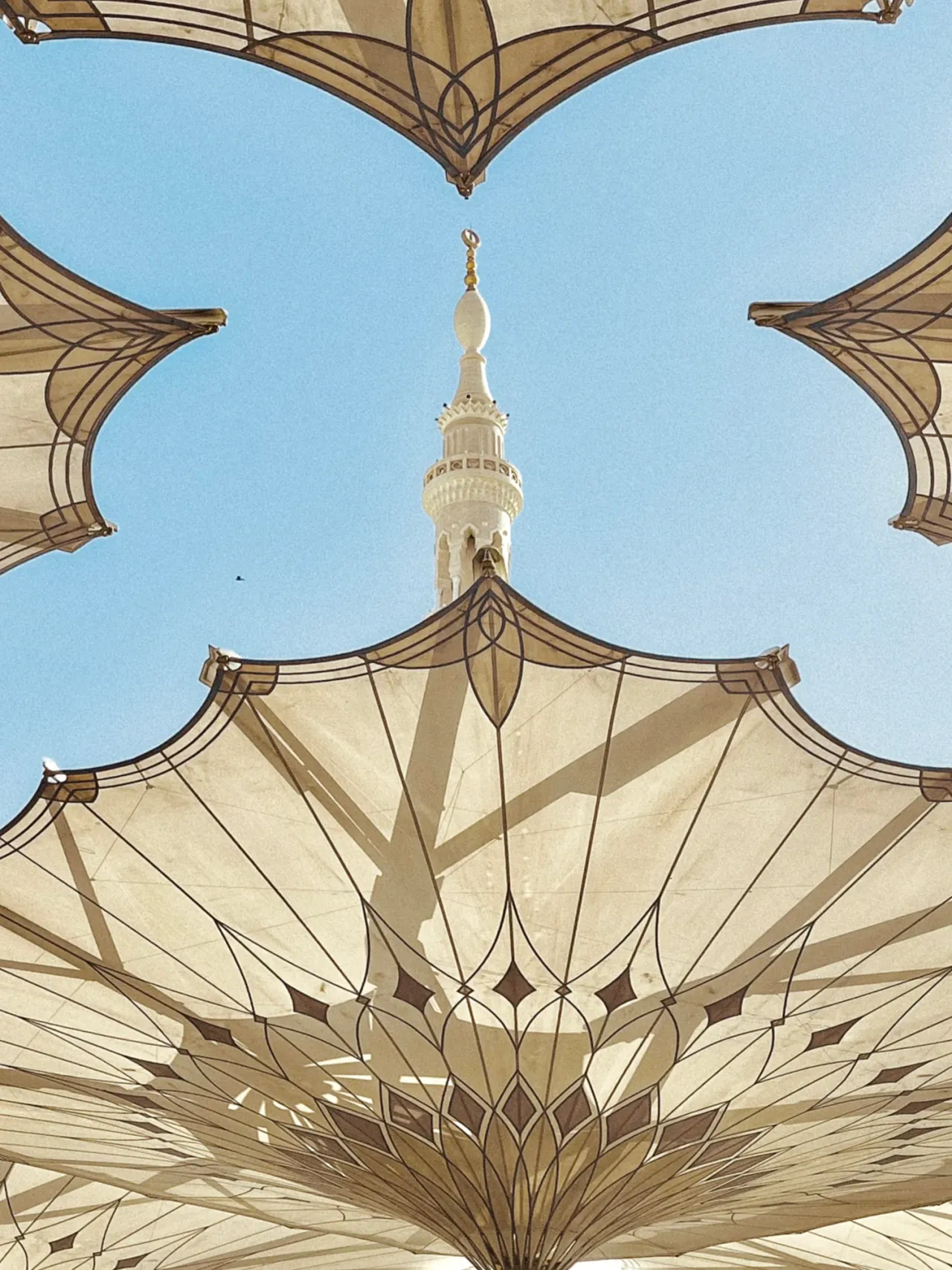 Shading canopies framing a minaret