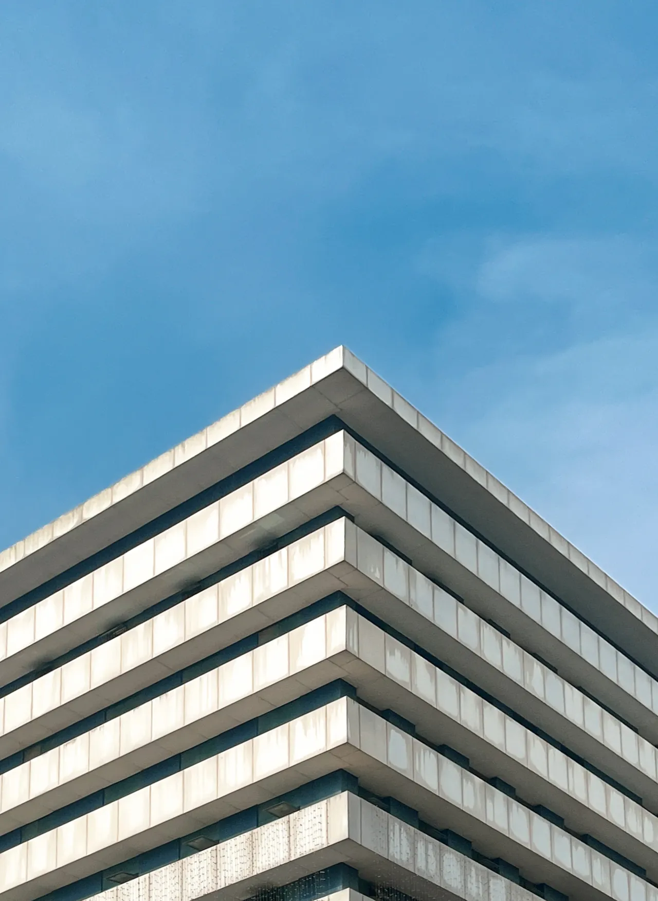 Horizontal bands wrapping a building corner