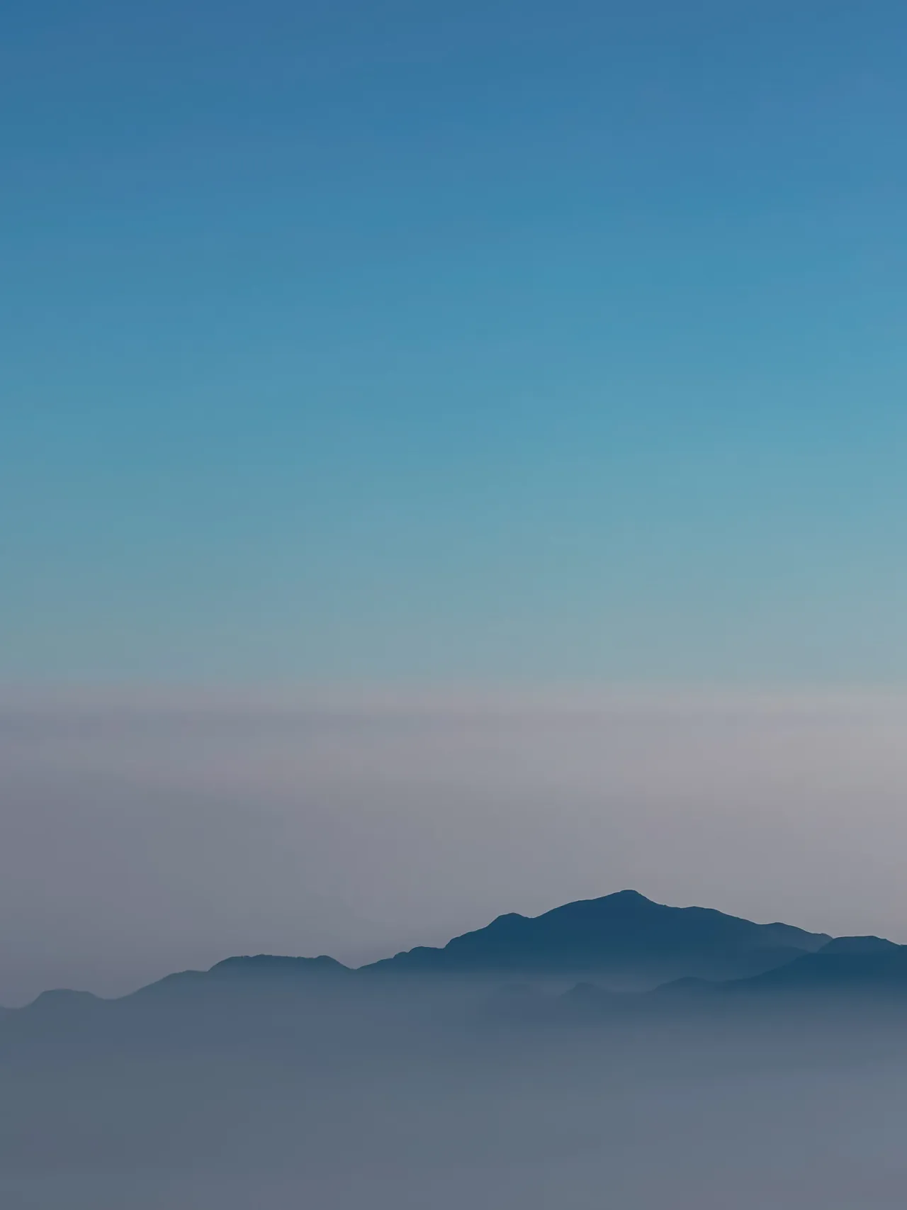 Distant mountains in layers of haze