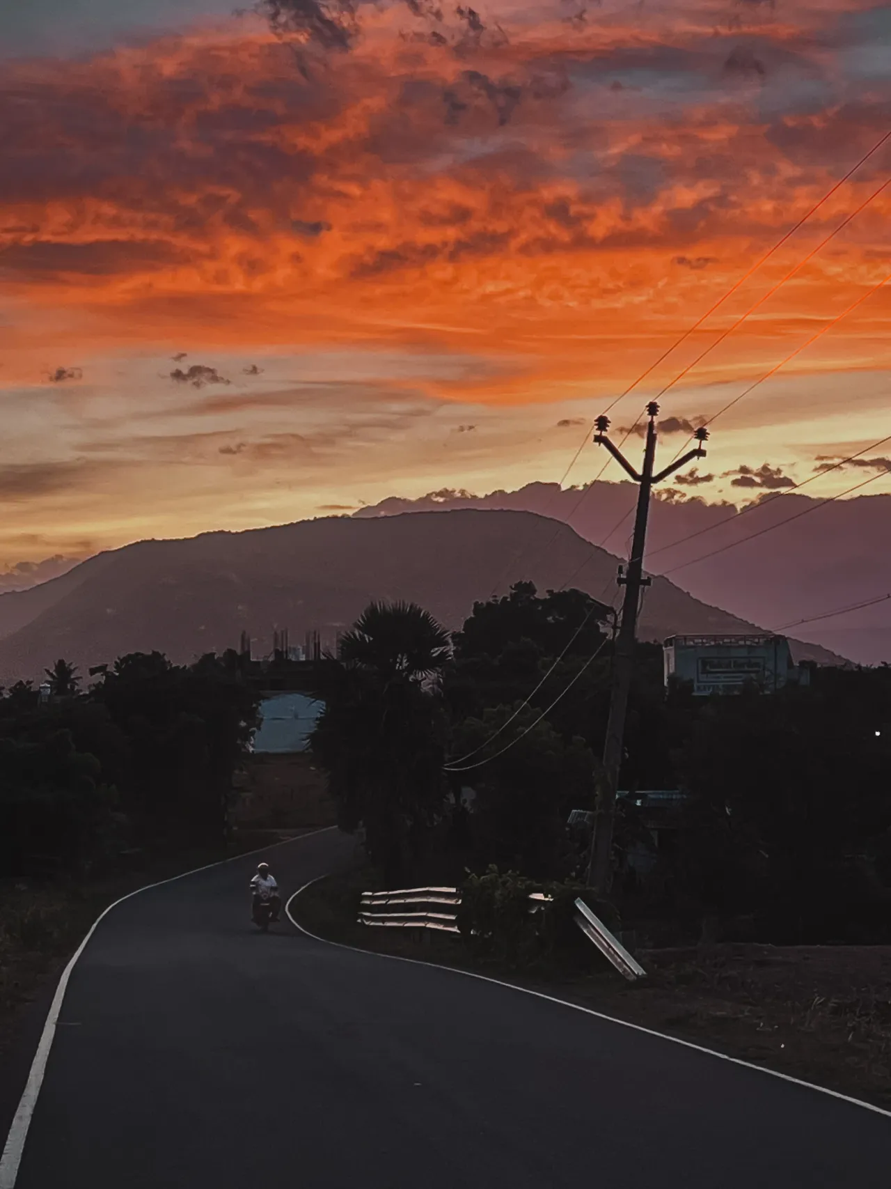 A road beneath a vivid evening sky
